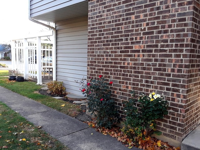 view of home's exterior with brick siding