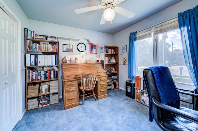 carpeted home office with ceiling fan