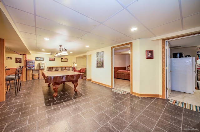 game room featuring baseboards, a drop ceiling, and recessed lighting