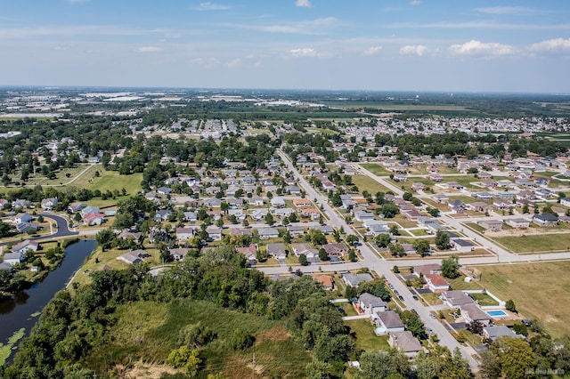 birds eye view of property featuring a water view and a residential view