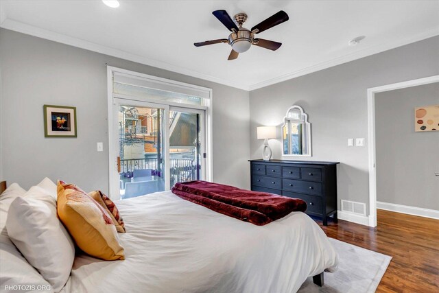 bedroom with visible vents, dark wood-type flooring, ornamental molding, access to outside, and baseboards