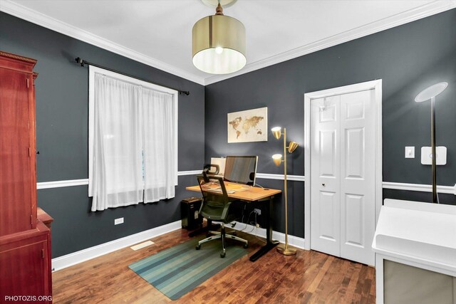 office space with baseboards, ornamental molding, and wood finished floors