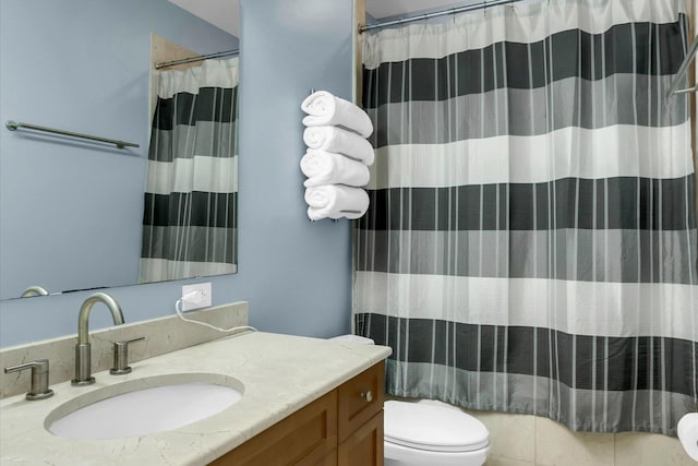 bathroom featuring toilet, a shower with shower curtain, and vanity