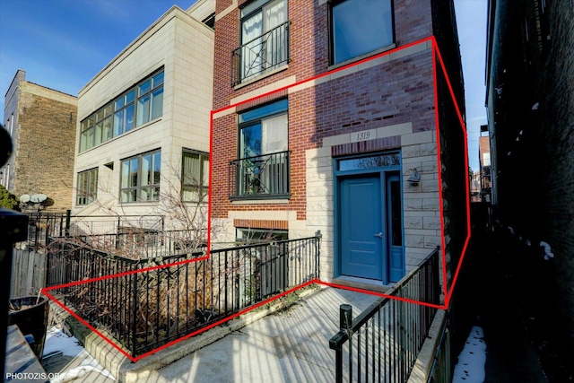 property entrance with brick siding