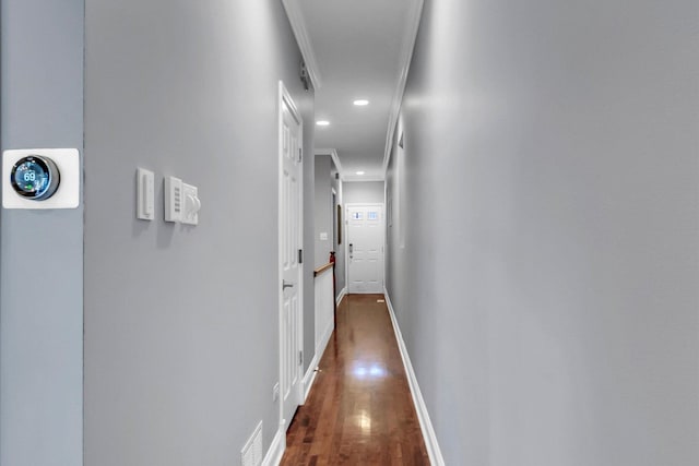 hallway with recessed lighting, dark wood finished floors, and baseboards