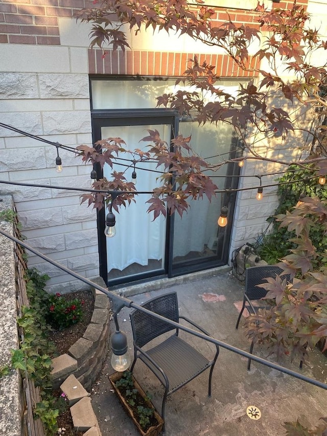 property entrance with brick siding