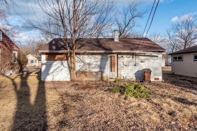 rear view of house with a chimney