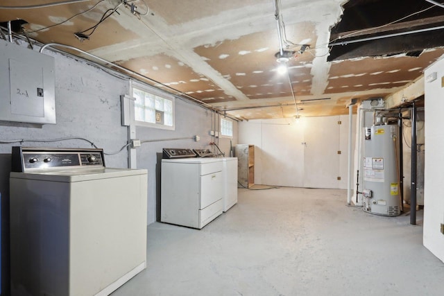 below grade area featuring gas water heater, electric panel, and independent washer and dryer