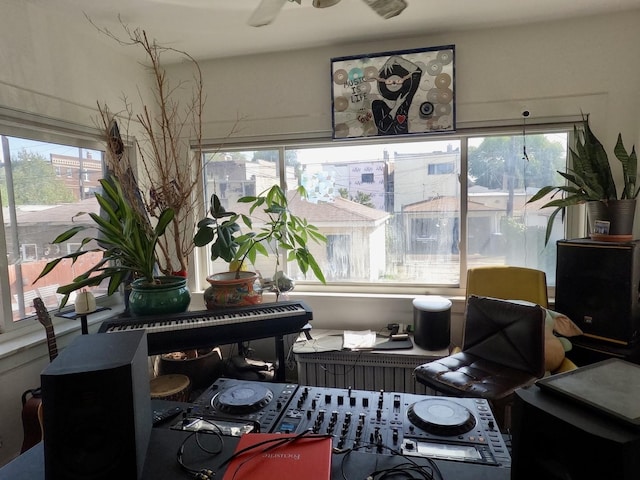 interior space with a healthy amount of sunlight and ceiling fan