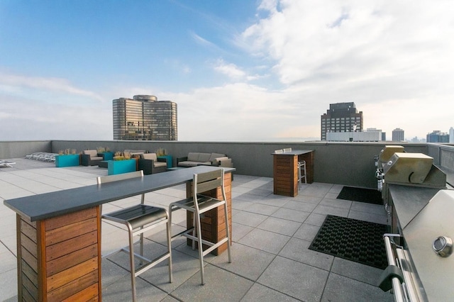 view of patio / terrace with outdoor lounge area and a city view