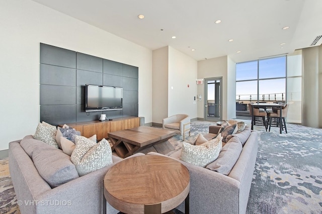 living room featuring carpet and recessed lighting