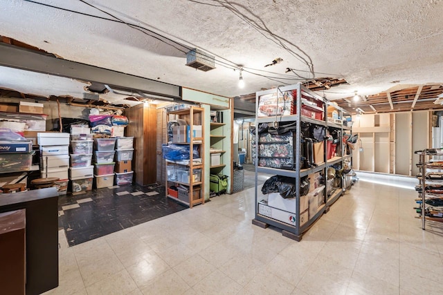 unfinished below grade area featuring tile patterned floors and a textured ceiling