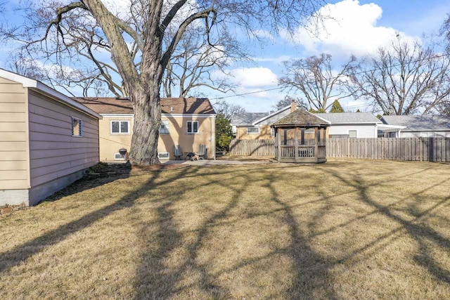 view of yard featuring a gazebo and fence