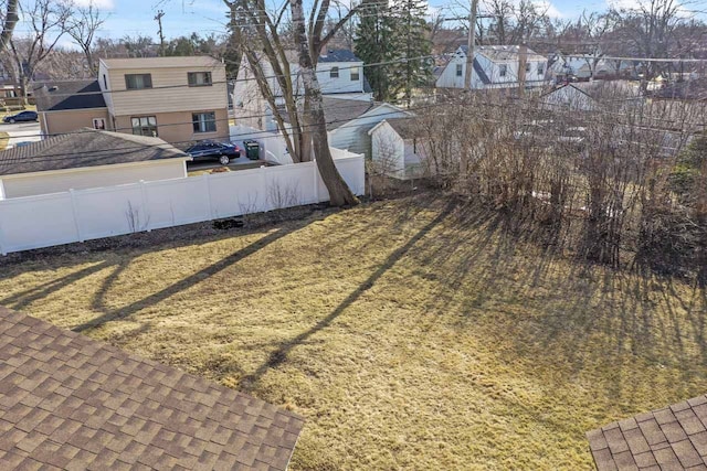 view of yard with a residential view and fence