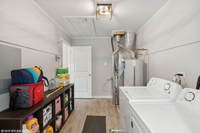 laundry room with laundry area, attic access, washer and clothes dryer, light wood-style flooring, and gas water heater