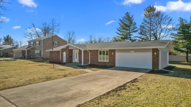 view of front facade with a front lawn, driveway, fence, a garage, and brick siding