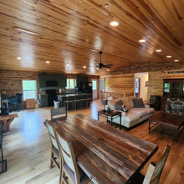 dining room with lofted ceiling, wooden ceiling, light wood-style flooring, and recessed lighting