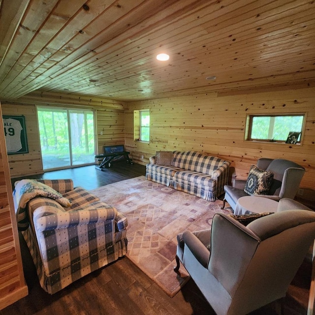 living area featuring wood ceiling, wooden walls, and wood finished floors