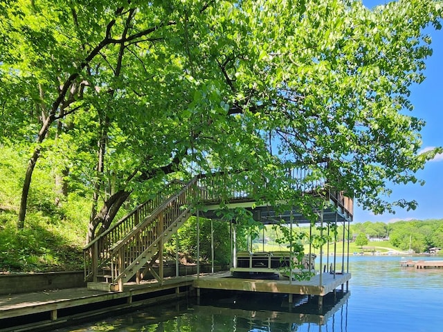 view of dock with stairway and a water view