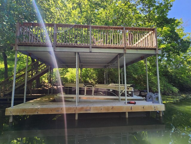 dock area featuring stairs and a wooden deck