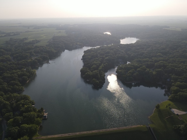 aerial view featuring a water view and a forest view