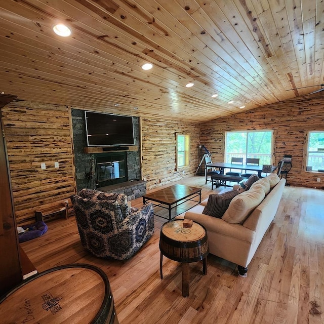 living area featuring lofted ceiling, wood ceiling, and hardwood / wood-style floors