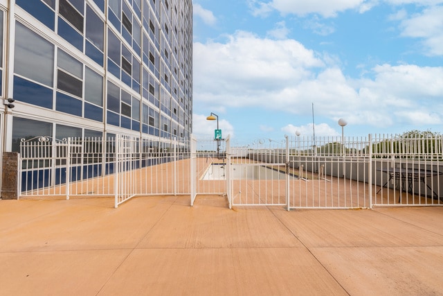 view of community featuring fence