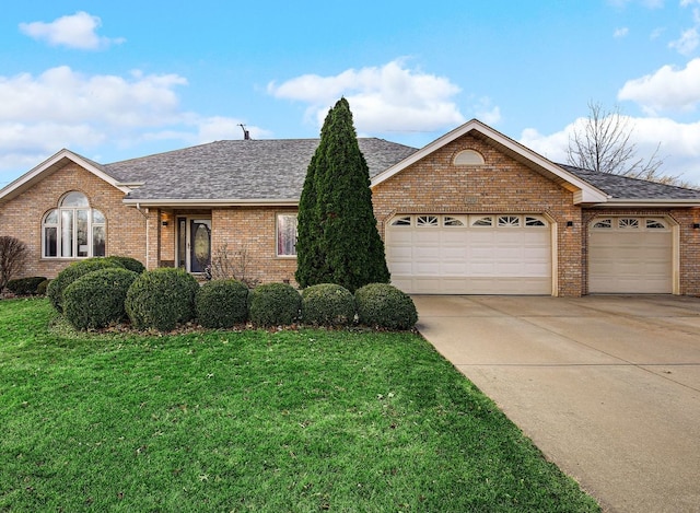 single story home with brick siding, roof with shingles, concrete driveway, an attached garage, and a front yard