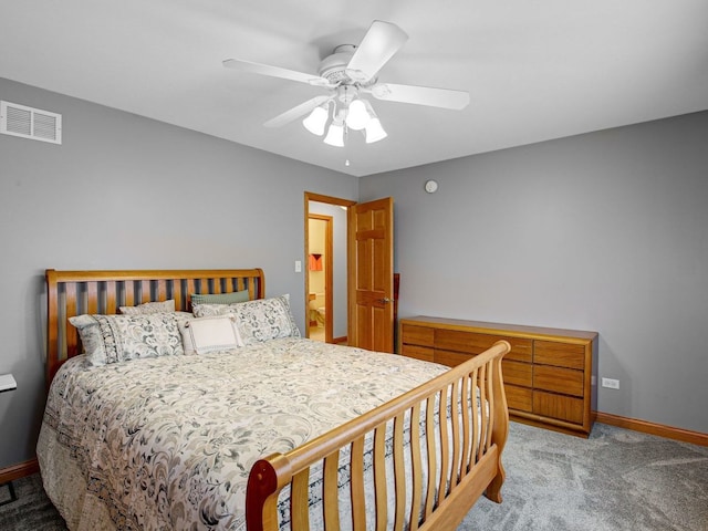 bedroom featuring baseboards, visible vents, ceiling fan, and light colored carpet