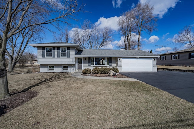 split level home featuring driveway and an attached garage