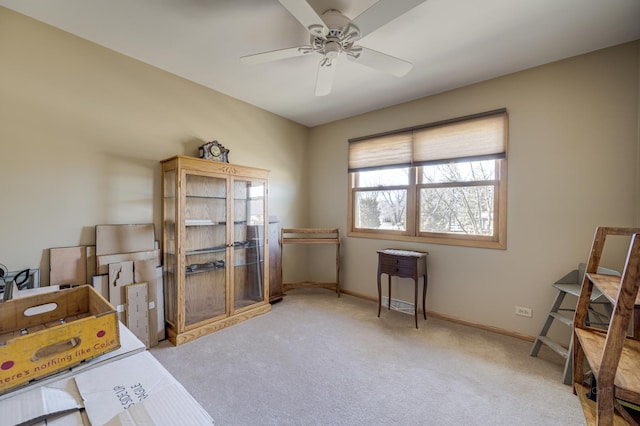 office with light carpet, baseboards, and a ceiling fan