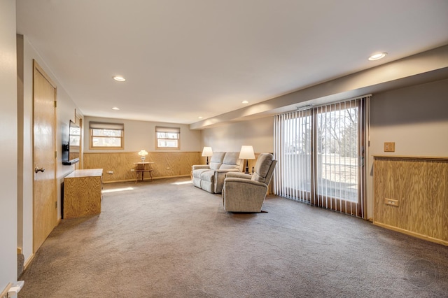 interior space featuring recessed lighting, a wainscoted wall, and wood walls