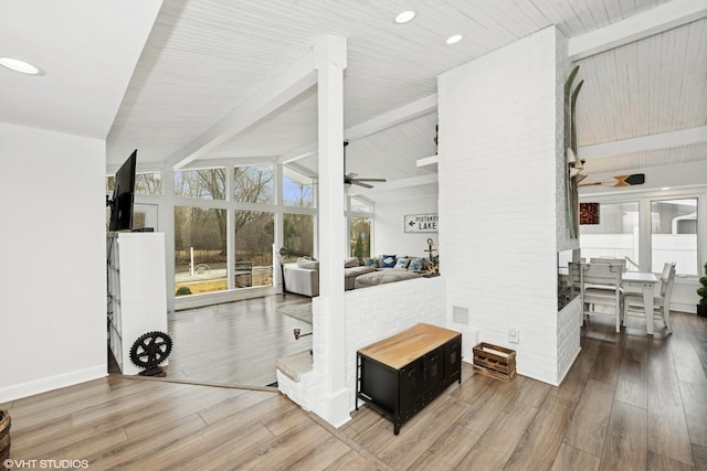 interior space with recessed lighting, vaulted ceiling with beams, ceiling fan, and wood finished floors