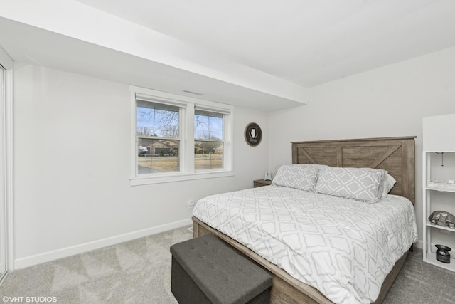 carpeted bedroom with baseboards