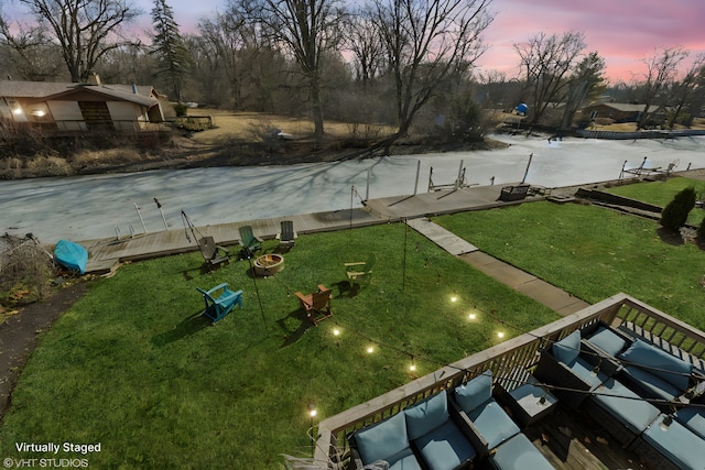 view of yard at dusk