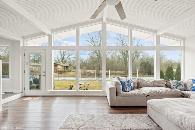 sunroom with a wealth of natural light and vaulted ceiling with beams