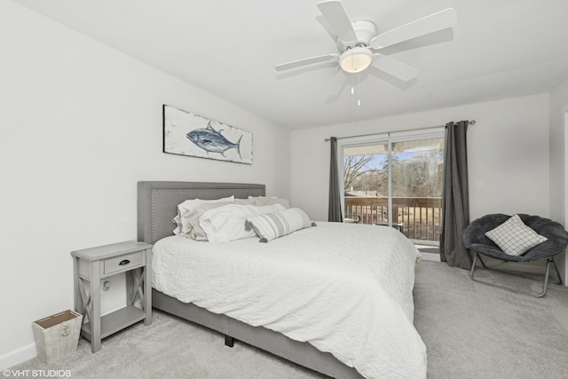 bedroom featuring light colored carpet, ceiling fan, and access to outside