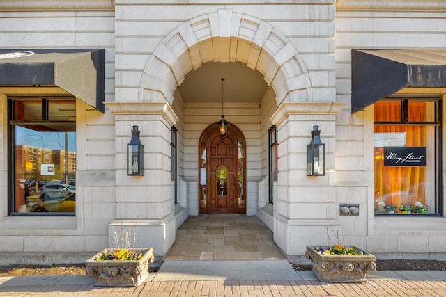 property entrance with stone siding