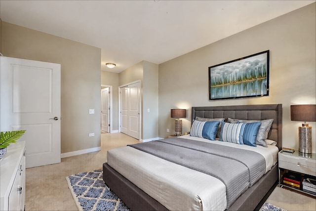 bedroom with baseboards and a closet