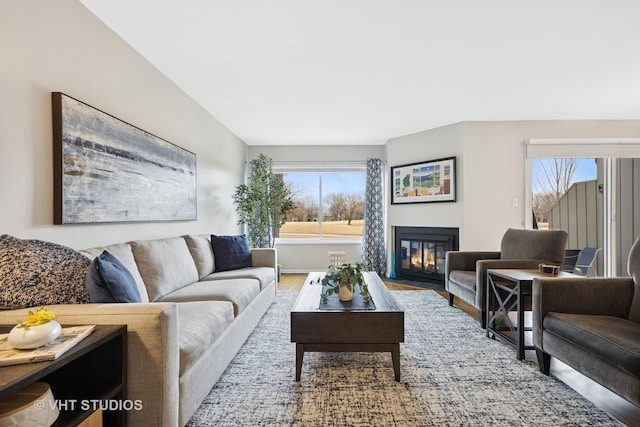 living room with a fireplace with flush hearth