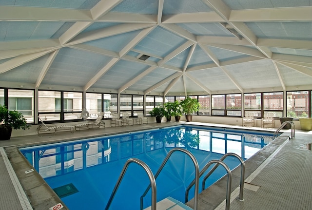 community pool featuring a lanai and a patio area