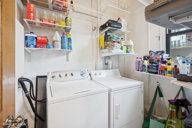 clothes washing area with laundry area and washing machine and clothes dryer