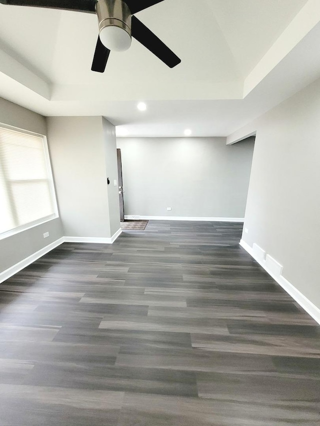 unfurnished room featuring ceiling fan, baseboards, wood finished floors, and recessed lighting