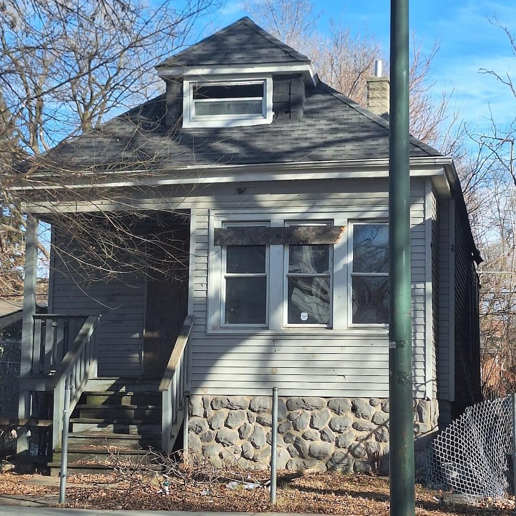 view of side of home featuring a chimney