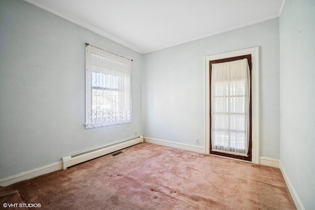 carpeted empty room with a baseboard radiator, baseboards, and crown molding