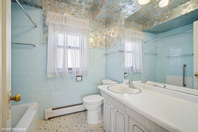 bathroom with tile walls, a baseboard radiator, toilet, vanity, and wallpapered walls