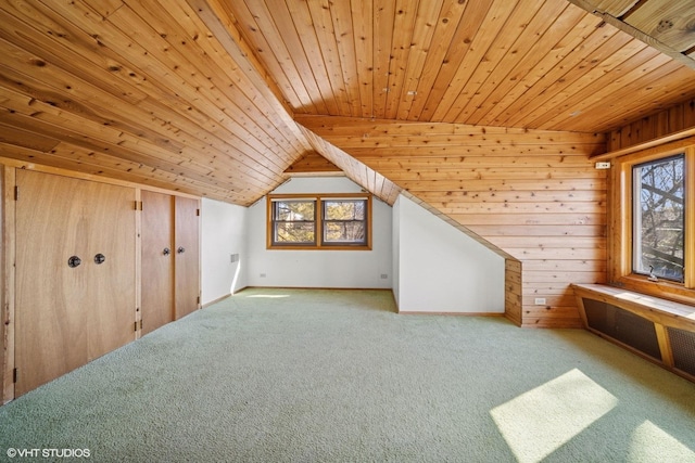 additional living space featuring carpet, wood ceiling, wooden walls, and vaulted ceiling