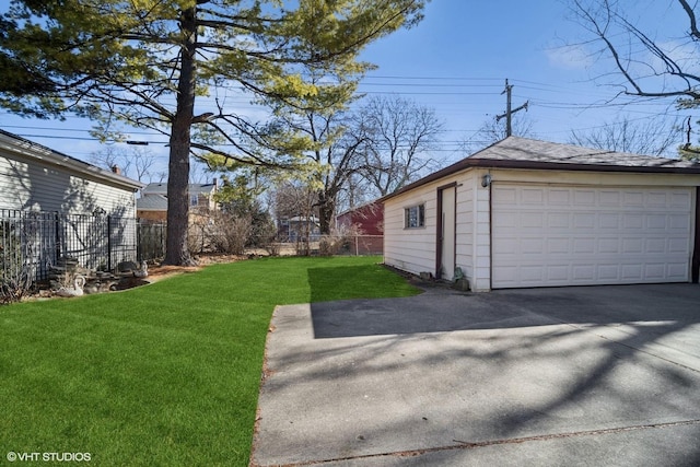 detached garage featuring fence