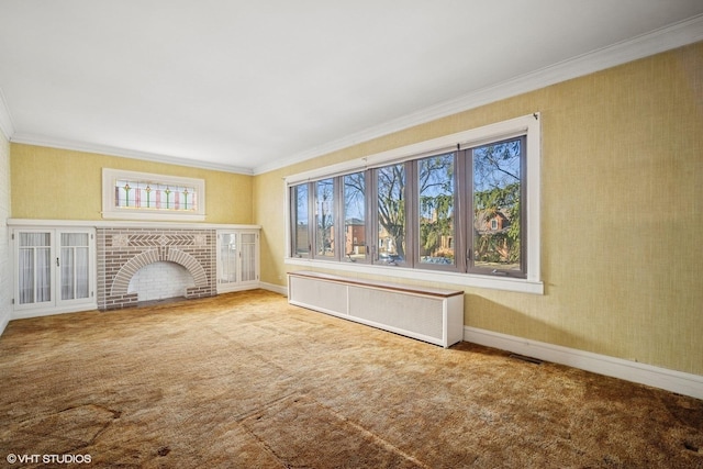 unfurnished living room with carpet, radiator heating unit, a fireplace, and plenty of natural light