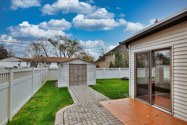 view of yard with a patio area, an outdoor structure, a fenced backyard, and a storage shed